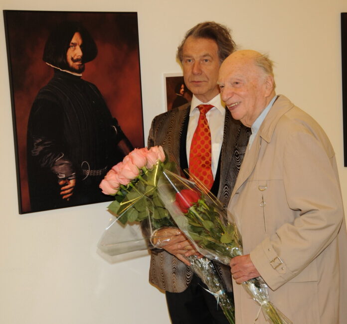 Портрет Оскара Фельцмана на фоне нот и музыкальных инструментов, символизирующих его богатое творческое наследие.